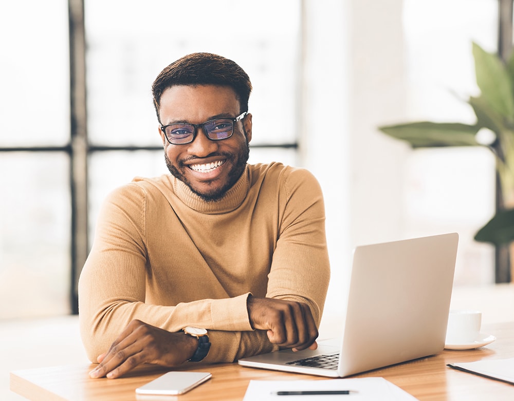 Happy Black Businessman Looking At Camera, Working With Pleasure, Selective Focus