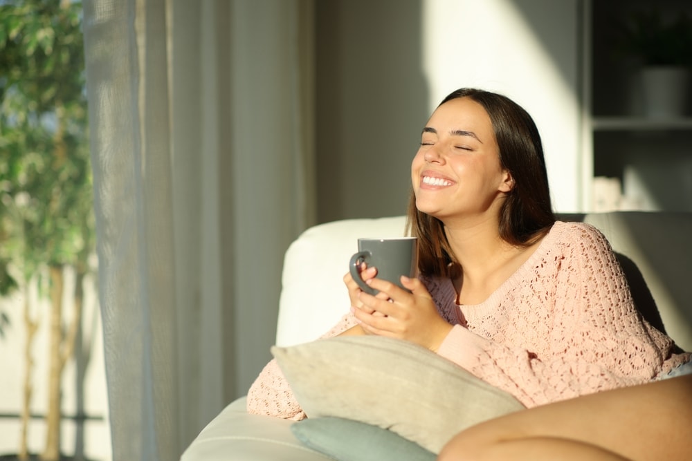 Woman with coffee smiling